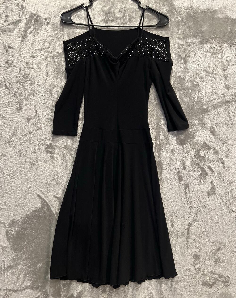 Fit-and-flare dress distinctive off-the-shoulder neckline adorned w/ rhinestones